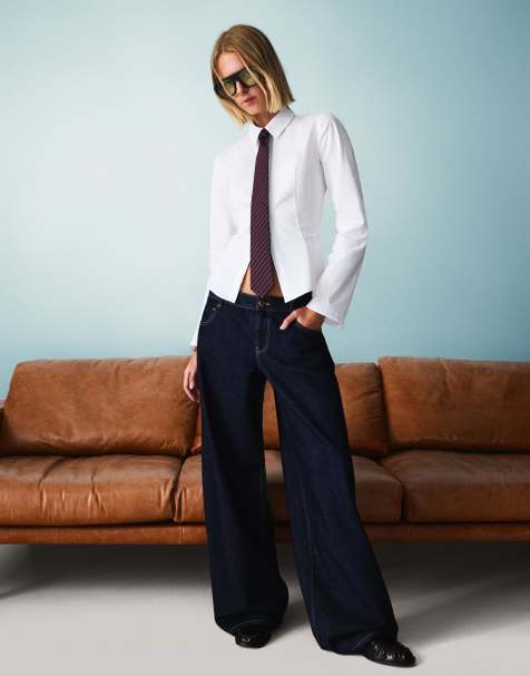 Bershka - Jeans met wijde pijpen en lage taille in marineblauw - view 1