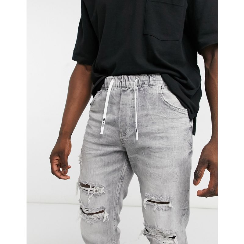 EIMkP Uomo Bershka - Joggers di jeans grigi con strappi