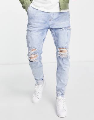 Bershka - Joggers en jean avec déchirures - Bleu