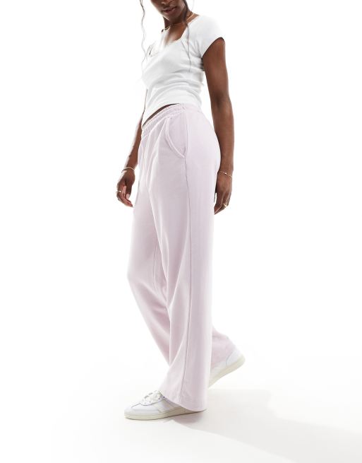 Bershka - Joggingbroek met wijde pijpen in roze met wassing