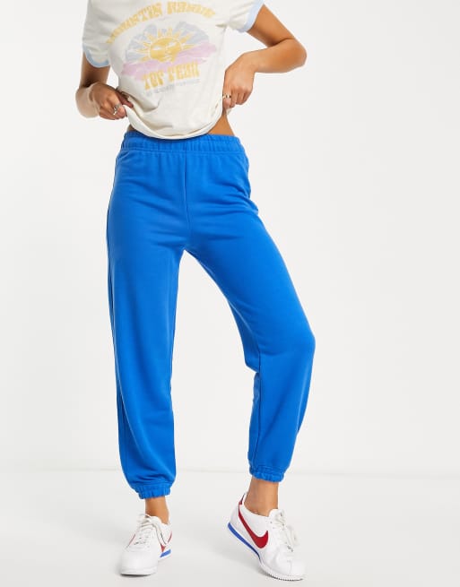 Bershka – Jogginghose in Kobaltblau mit Slogan und Bündchen