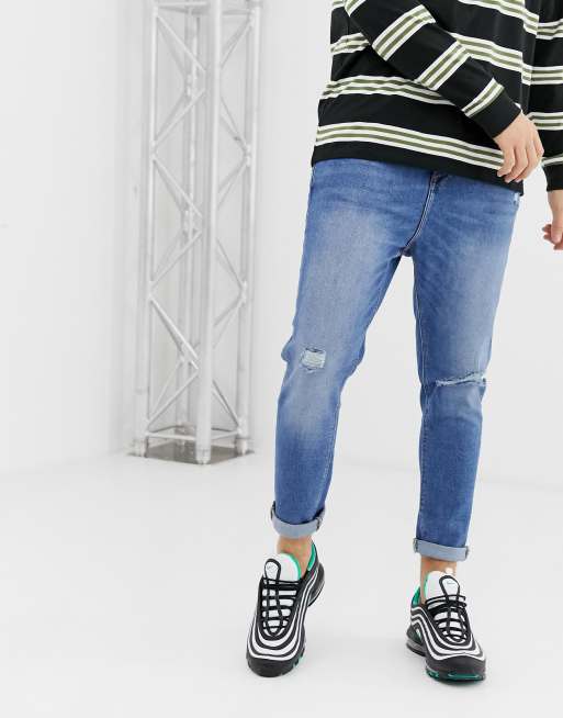 Bershka Join Life carrot fit jeans with rip and abrasions in mid blue