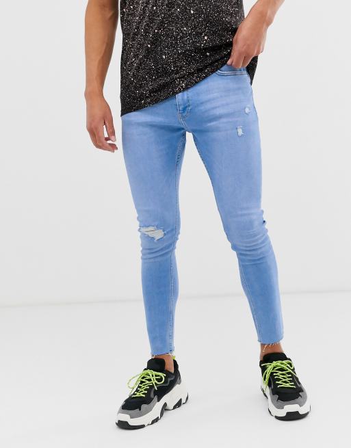 Bershka – Join Life – Jasnoniebieskie jeansy o bardzo obcisłym kroju z dziurą na kolanie i wytarciami