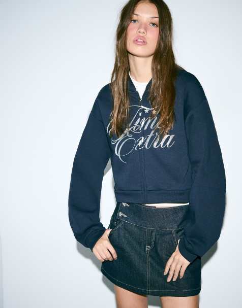 Bershka – Kapuzenjacke in Blau mit Reißverschluss und glitzerndem Textprint - view 1