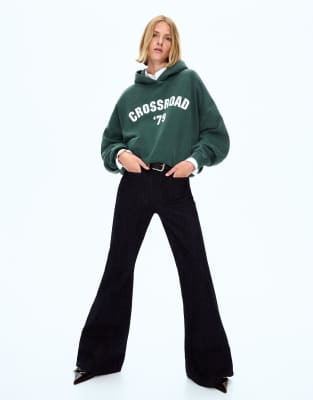 Bershka - Kapuzenpullover in Grün mit Print