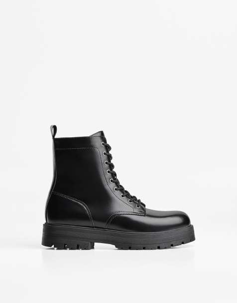 Bershka Lace-up track sole ankle boots in black - view 1