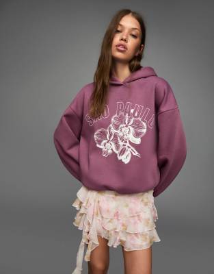 Bershka - Langärmliges Sweatshirt in Lila mit Grafikmotiv
