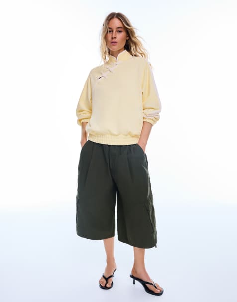 Bershka Langärmliges Sweatshirt mit Stehkragen und Verschlüssen in Gelb - view 1