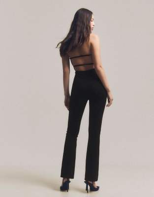 Bershka - Langer, figurbetonter Jumpsuit in Schwarz mit Strassbesatz