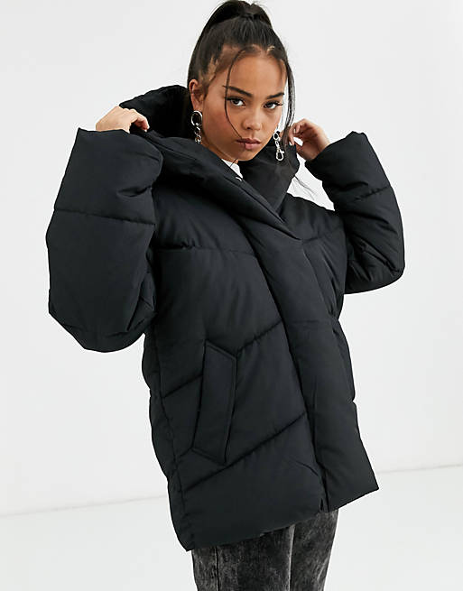 Bershka longline puffer coat with hood in black | ASOS