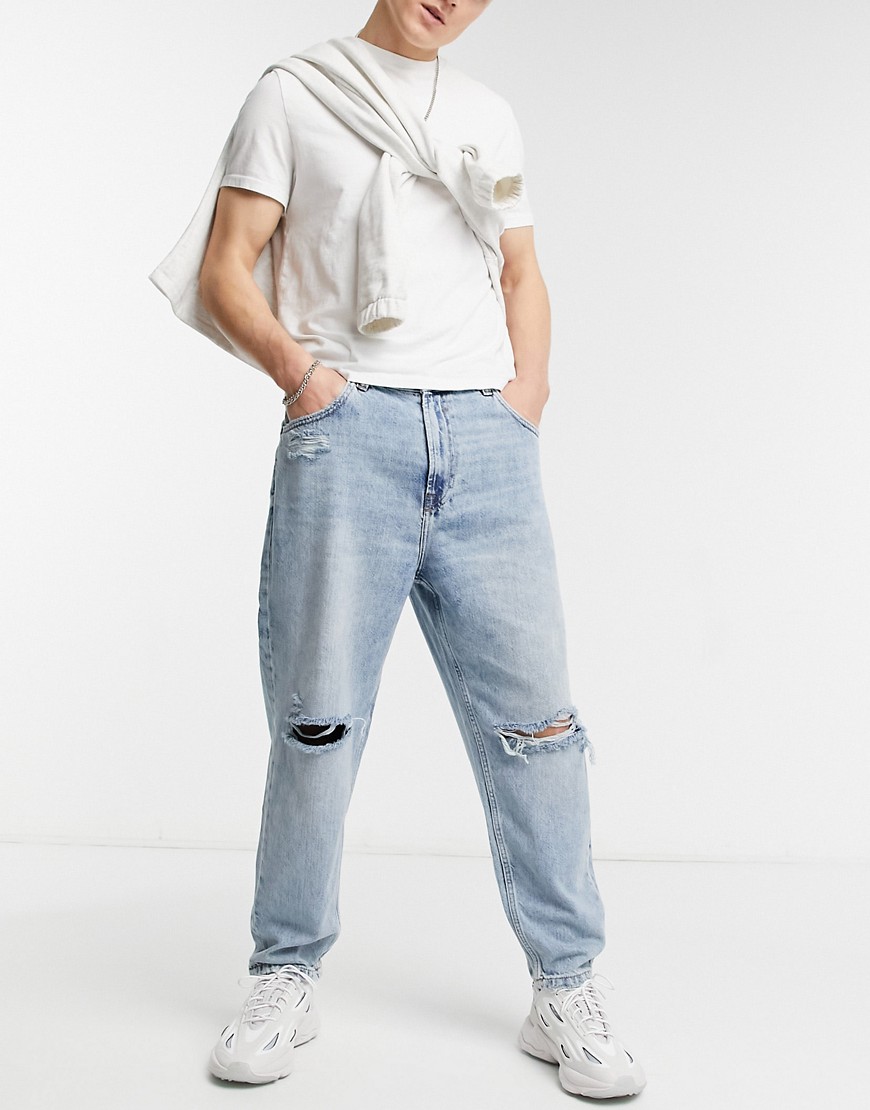 Bershka loose fit jeans with knee rip in washed blue-Blues