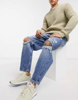 Bershka loose fit jeans with rips in mid blue wash-Blues