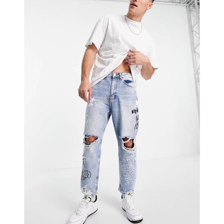 Bershka loose fit jeans with rips in mid blue ASOS