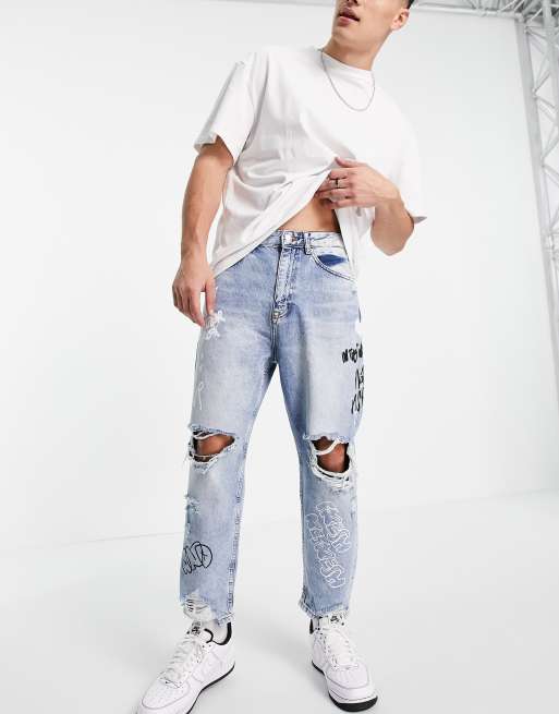 Bershka loose fit jeans with rips in mid blue | ASOS