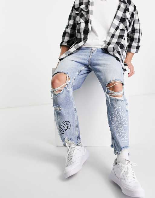 Bershka loose ripped jeans in mid blue