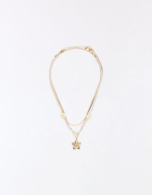 Bershka - Lot de colliers avec fleurs - Doré