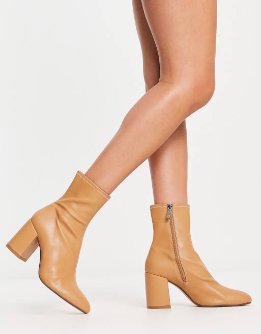 Bershka low heel sock boots in beige ASOS