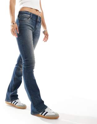 Bershka low rise boot cut jeans in dark washed blue | ASOS