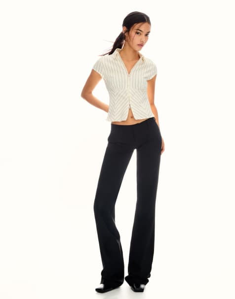 Bershka Low-rise boot-cut trousers in black - view 1