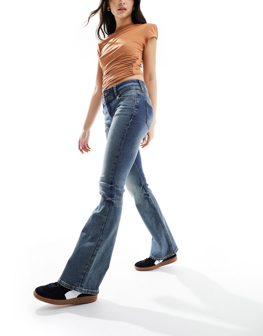 low waist bootcut jeans in dirty wash blue