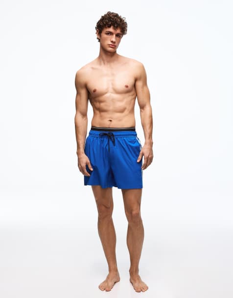 Bershka – Marinblå, mönstrade badshorts med boxig passform och dubbla midjeband - view 1