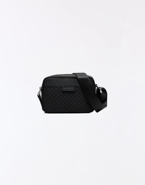Bershka Monogram crossbody bag in black - view 1