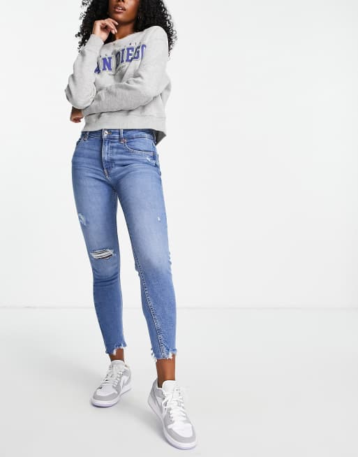 Bershka – Niebieskie obcisłe jeansy z niskim stanem i rozdarciami, 4 z 4