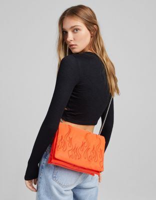 Bershka nylon shoulder bag with embossed flame in orange with chain handle