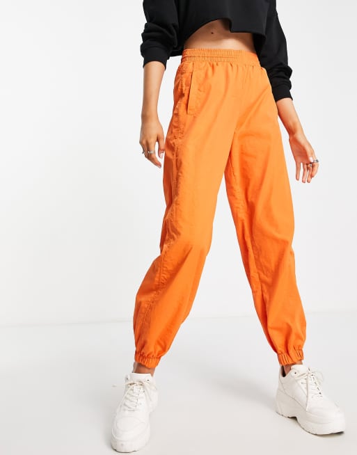 Bershka – Orange fallskärmsbyxor i nylon och cargostil