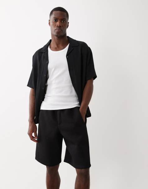 Bershka Oversize neoprene-effect bermuda shorts in black - view 1