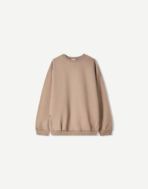 Bershka Oversize sweatshirt with pockets in beige