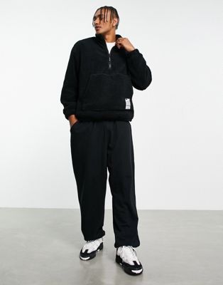 Bershka oversized half zip jumper in black teddy borg