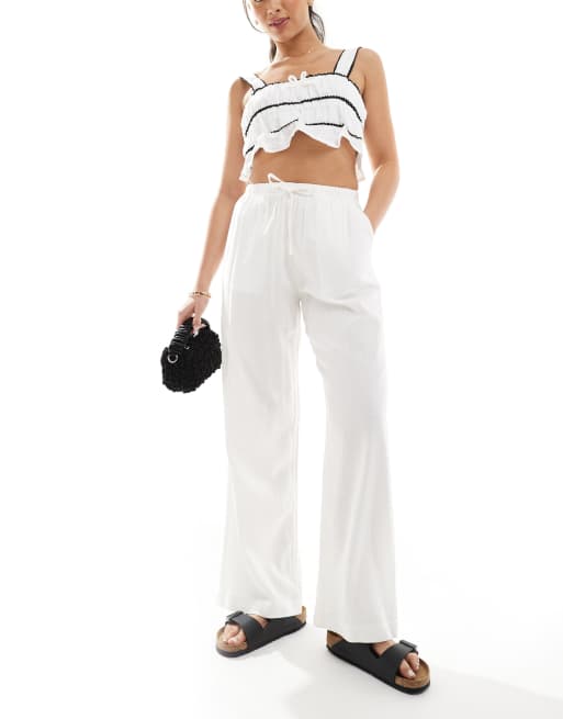 Bershka - Pantalon large en lin noué à la taille - Blanc