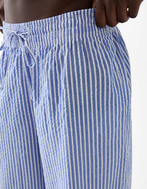 Bershka Pantaloni a fondo ampio blu a righe con fascia in vita ASOS