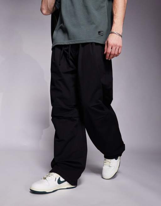 Bershka parachute baggy pants in black | ASOS