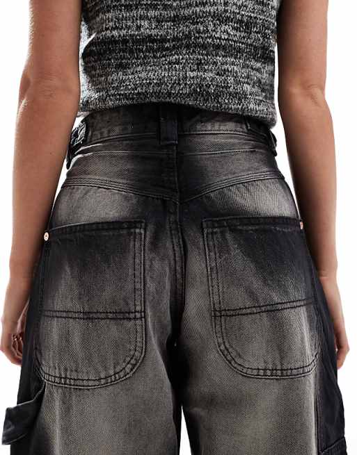 Bershka Petite adjustable waist carpenter jeans in acid wash Bershka Petite adjustable waist carpenter jeans in acid wash