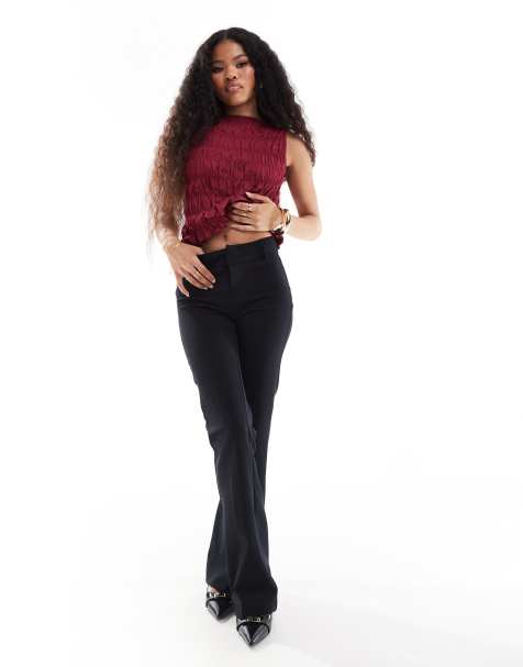 Bershka Petite flared tailored trousers in black - view 1