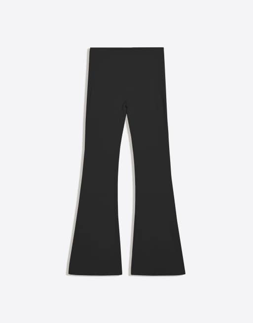 Bershka Petite flared technical fabric trousers in black, 6 of 6