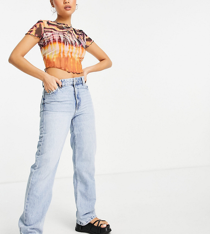 Bershka Petite high waisted dad jeans in bleached wash-Blues