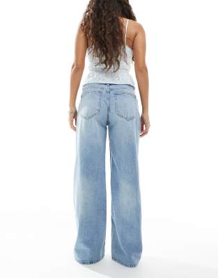 Shop Bershka Petite High Waisted Wide Leg Jeans In Blue