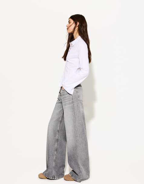 Bershka Petite - Jeans met wijde pijpen in lichtgrijs - view 1