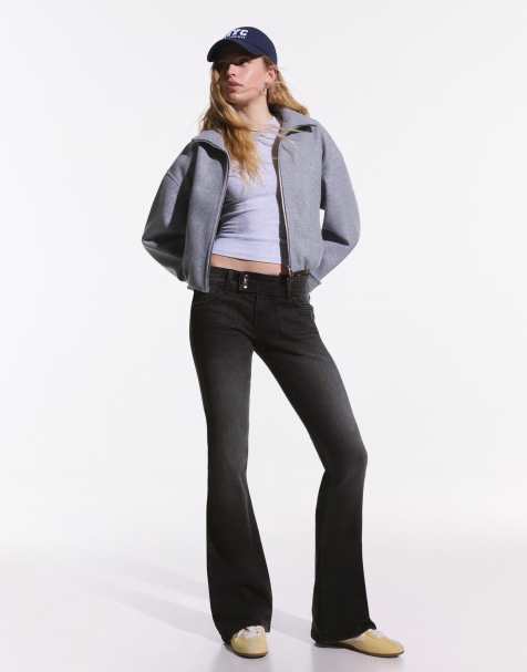 Bershka Petite low rise bootcut jeans in black