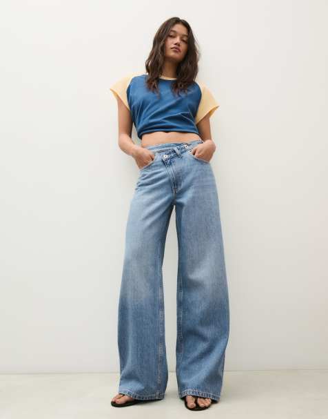 Bershka Petite wide-leg cross-waist jeans in mid blue - view 1