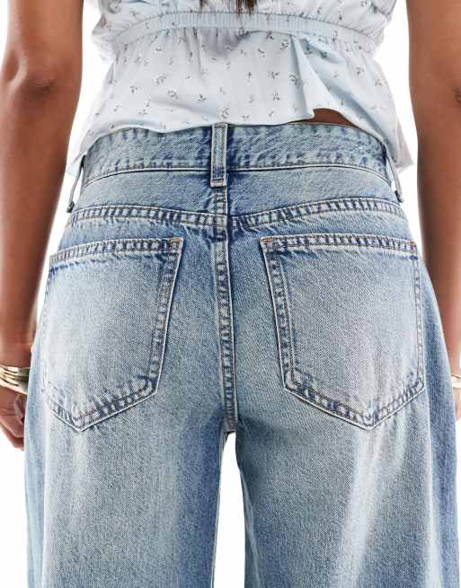 Bershka Petite wide leg jeans in mid wash blue