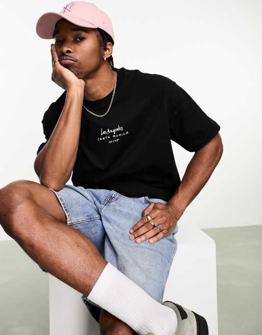 ASOS DESIGN oversized T-shirt in black with photographic spine