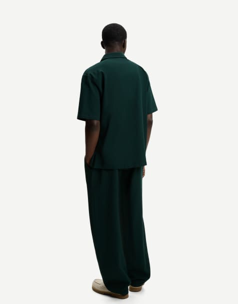 Bershka pleated baggy jogger trousers in green - view 1