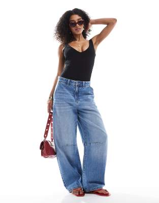 Shop Bershka Plunge Neck Bodysuit With Side Ruching In Black