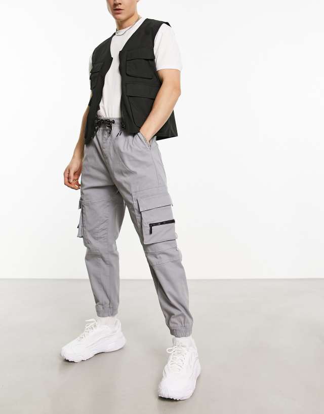 Bershka pocket cargo sweatpants in gray exclusive to ASOS