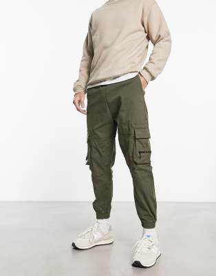 Bershka pocket cargo trackies in khaki exclusive to ASOS 