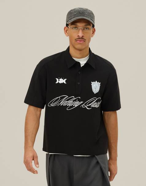 Bershka - Polo nera a maniche corte con ricami - view 1